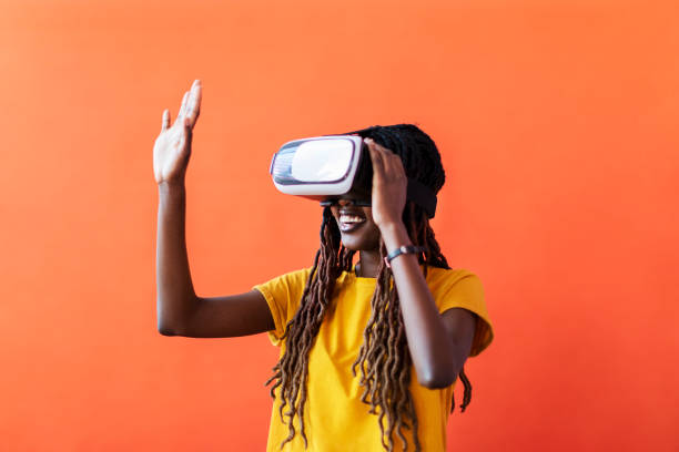 istock Black young woman in virtual reality glasses 1440704925