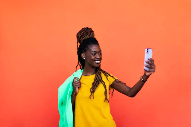 istock Young Black woman using phone 1440704950