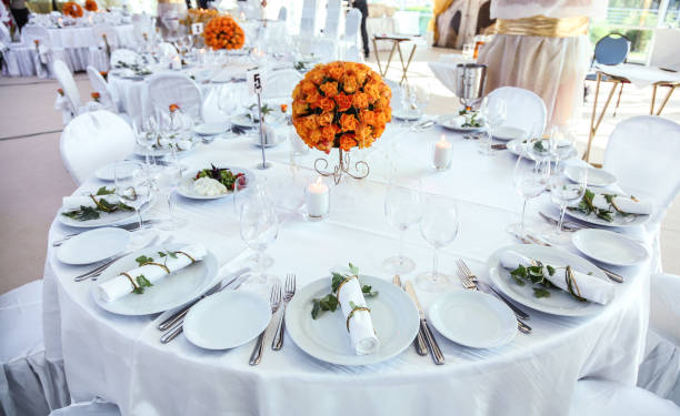 istock Holiday table setting decorated with flowers and candles. 1440707721