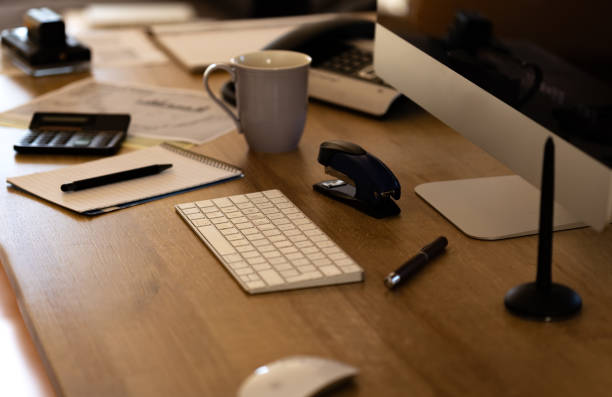istock Desk with office implements. 1440707799
