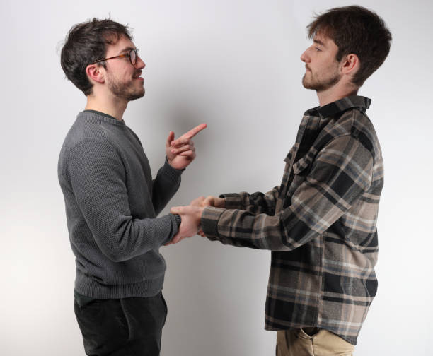 istock two young men shake hands to say hello or to make a deal 1440710529