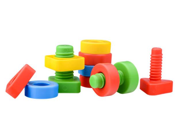 Multi-colored plastic children's construction kit, isolated on a white background. Design and modeling. Development of children's motor skills and thinking. Building different models.