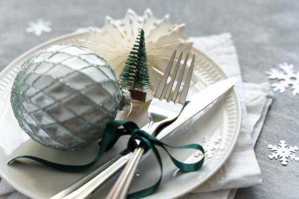 istock A white plate with cutlery and christmas decorations 1440714443