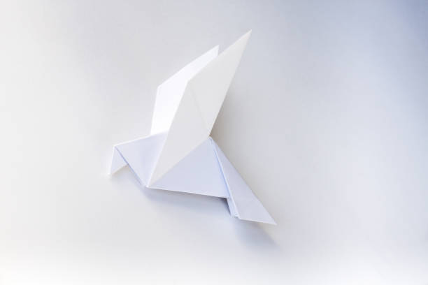 istock Paper dove origami isolated on a white background 1440715327