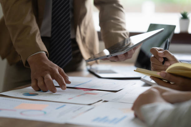 istock Group of business consultant working management big data and analyze financial document of company. account, finance, business concept 1440715462
