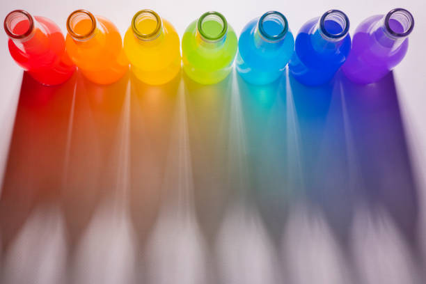 Rainbow colors in bottles with colored liquids. Rainbow shadows and place for text. Free space , copy space.