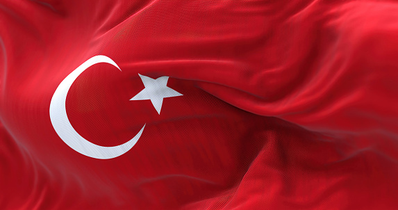Close-up view of the Turkey national flag waving. the Republic of Turkey is a transcontinental country. Fabric textured background. Selective focus. 3D illustration