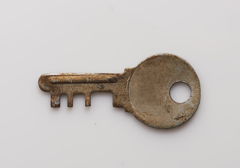 Old key isolated on white background. without shadow