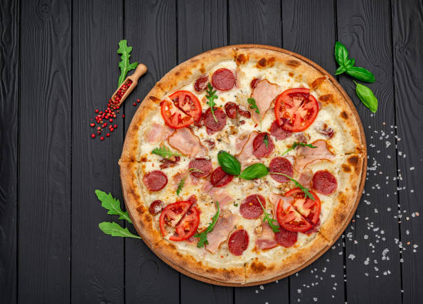 istock Pizza with mozzarella cheese, salami and chicken meat 1440721301