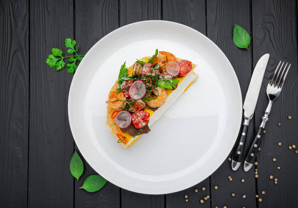 Omelet pulyar with shrimp and grilled mushrooms. Healthy food concept.