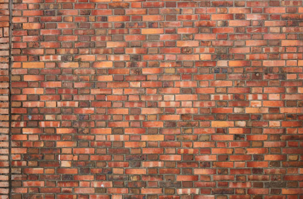 istock Weathered and Textured Brick wall grunge background. 1440721598