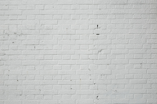 White Brick wall with broken and old bricks texture.