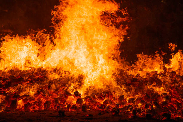 istock Fire by night. Flames and embers. Hot and inferno 1440721736