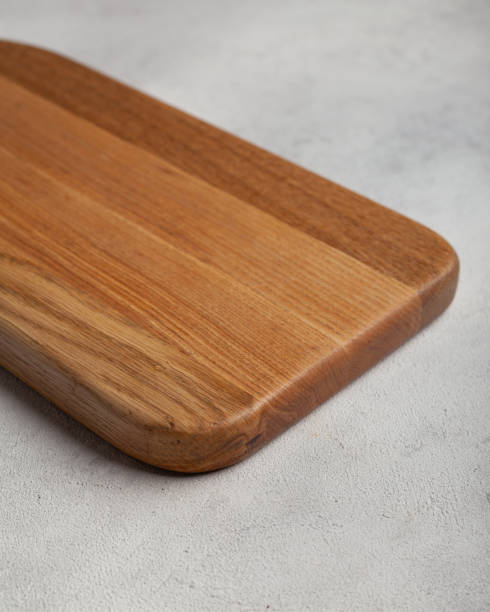 istock Wooden cutting board in the kitchen on a light background 1440722440