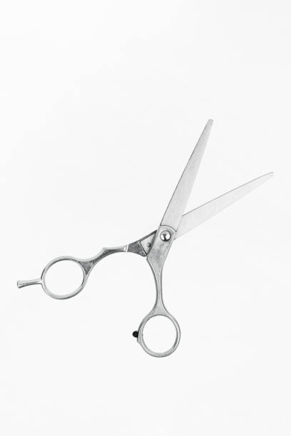 istock Professional flying scissors for haircuts on white background. Professional tool for hairdressers scissors 1440722514