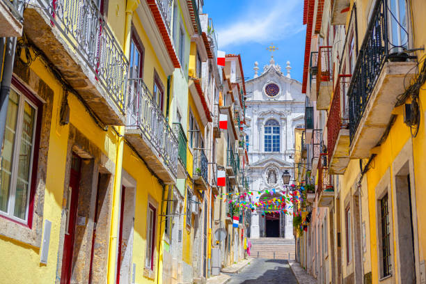 istock Old town street decorated by flags 1440723918