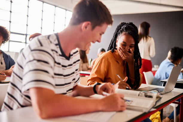 istock Students laughing together during a lesson in a classroom 1440723953