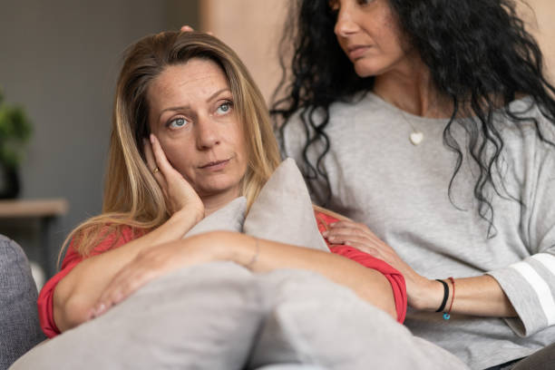 istock Women supporting sad friend trying to solve a problem. 1440724197