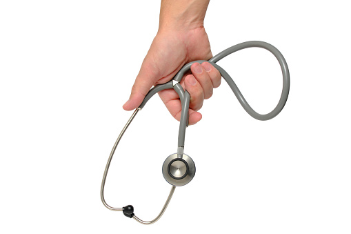 Male doctor hand holds a stethoscope, on a white background of isolate.Diagnostics heart, blood vessels, lungs, bronchi, intestines and other organs
