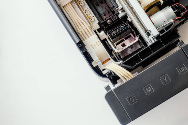 Part of printer on light background. View from top. Background. Service for repair and maintenance of printers and office equipment..