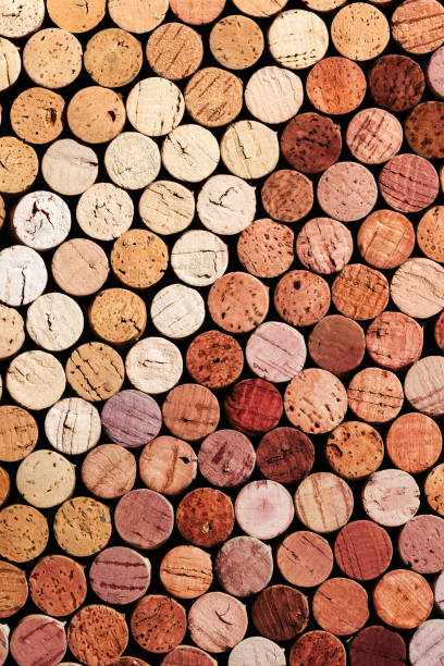 collection of wine cork from white and red wine, natural texture bottle stoppers top view, colorful background from wooden corks. natural textured stoppers colored. winery, winemaking concept. - wine bottle wine wood bottle stopper imagens e fotografias de stock