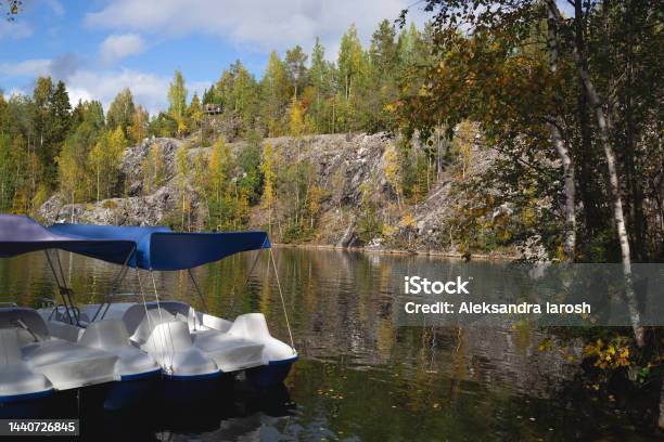 Catamarans Floating On The Lake In The Marble Canyon Surrounded By Autumn Forest Stock Photo - Download Image Now