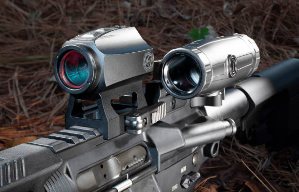 istock Magnifier to the side of a red dot scope on a modern sporting rifle 1440727288