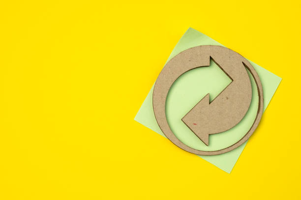 istock European recycling symbol from cardboard and paper packaging with copy space. 1440729963