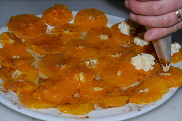 istock Juicy orange slices, flavored with sugar and cinnamon and fresh cheese. 1440730562