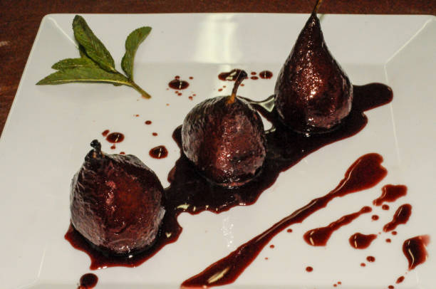 istock Pears in red wine bathed in their juice. 1440730584