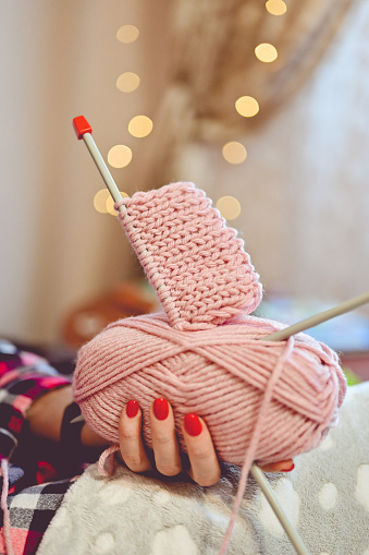 Wool yarn. Skeins of thread and knitting needles