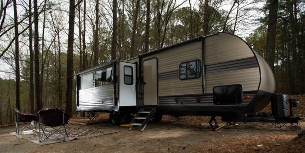 istock Trailer campsite set up in the forest 1440733952