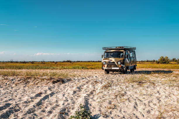 istock Old military bus van on the beach 1440734208