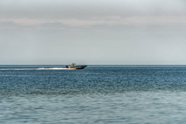 istock Boat running fast on the water 1440734238