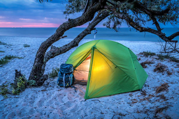 istock Tourist tent on the beach at sunrise 1440734253
