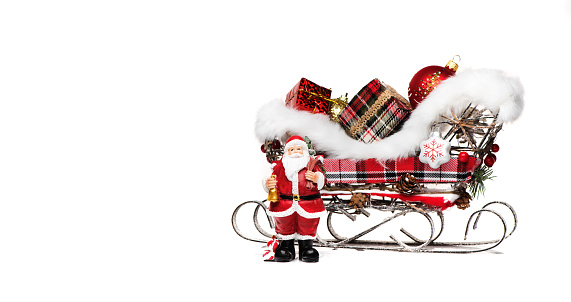 Santa Claus and sleigh with gifts on a white background. Merry Christmas and happy new year greeting banner