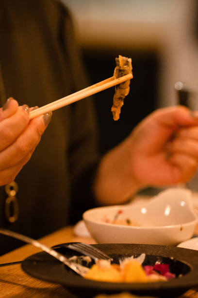 Eating loach tempura.Japan/Okinawa/Ginowan/Aichi