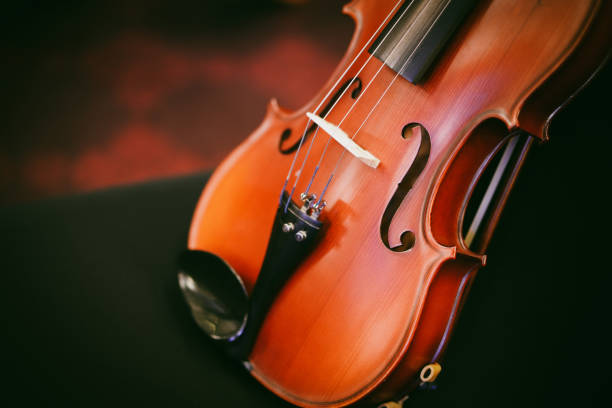 istock Violin on a black chair 1440739942