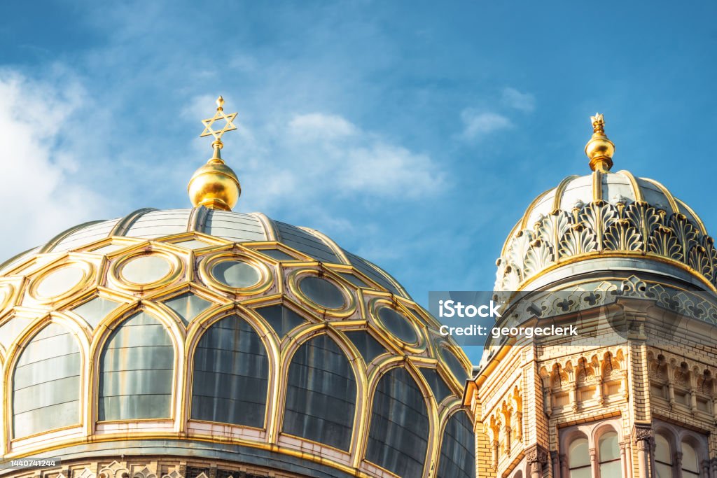 Domes of The New Synagogue in Berlin Detail of the ornate domes , with the Star of David on the main dome of the New Synagogue in Berlin, located centrally on Oranienburger Strasse. Synagogue Stock Photo
