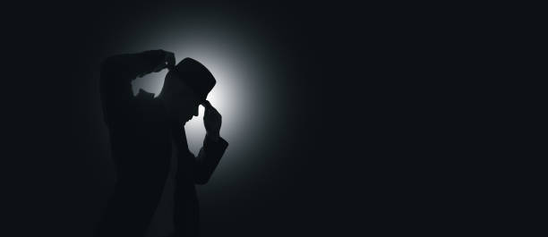 istock The man puts a hat on his head. Light source in the background 1440741854