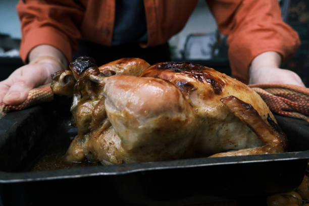 istock Serving roasted chicken for Thanksgiving dinner 1440741897