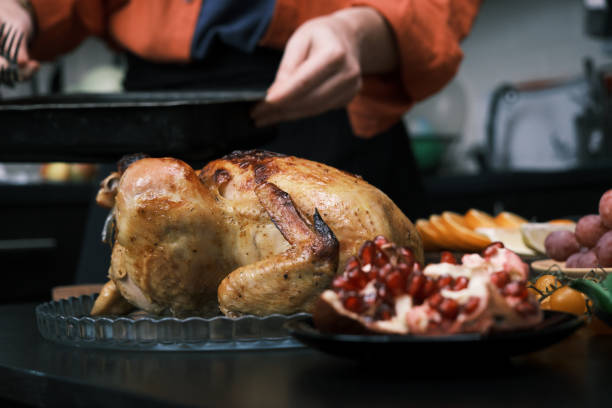 istock Serving roasted chicken for Thanksgiving dinner 1440742259
