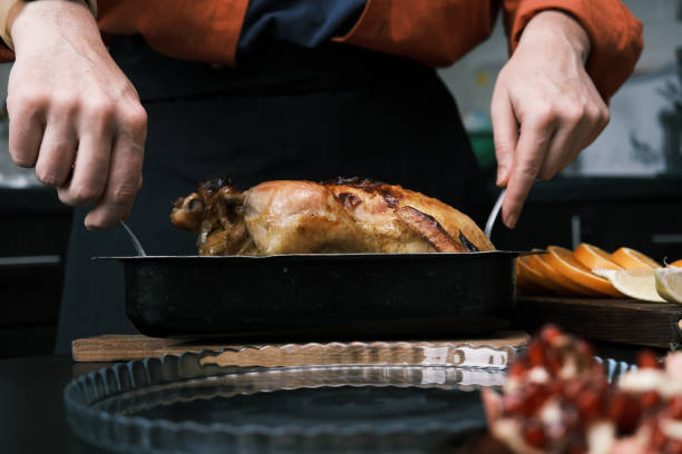 istock Serving roasted chicken for Thanksgiving dinner 1440742297