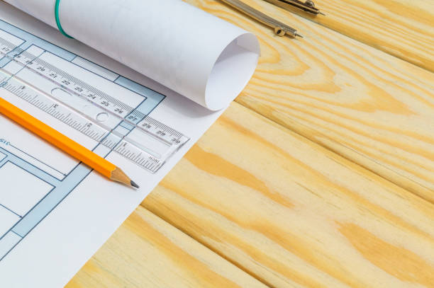 istock Accessories and drawing tools lie on a building project or wooden boards 1440742620