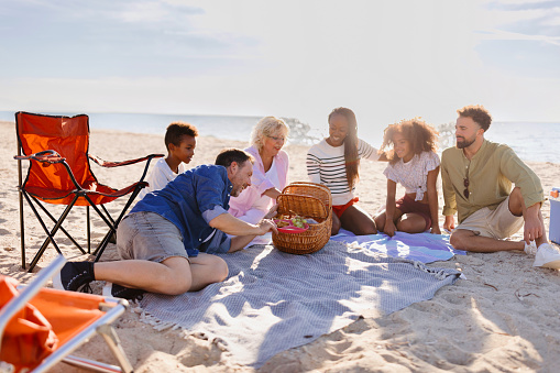 Multi generation family picnic on the beach
