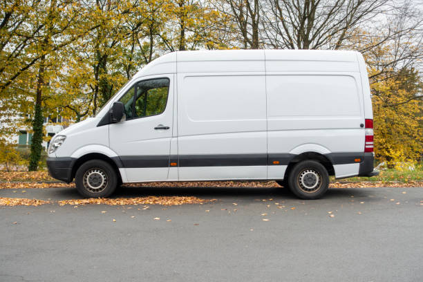 Parked white van Parked white van van stock pictures, royalty-free photos & images