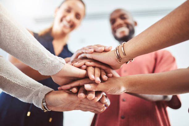 istock Hand, teamwork and motivation with a business team and their hands in a huddle while standing in a circle in the office together. Collaboration, goal and success with a group of staff in celebration 1440750429