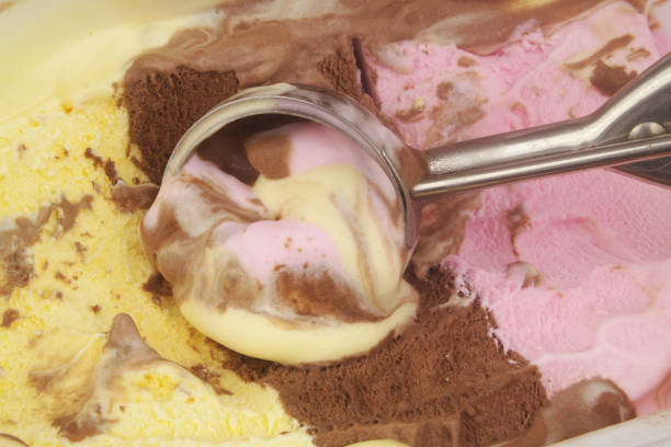 istock Strawberry, vanilla and chocolate ice cream with scoop. 1440751350