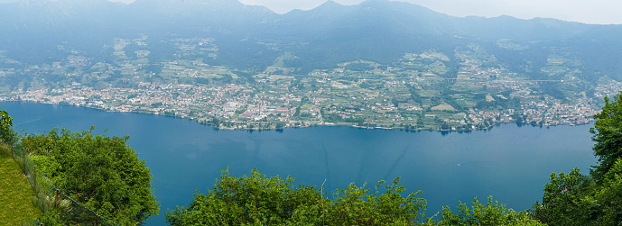 Panoramic view of the lake and island on a sunny day. Italy.