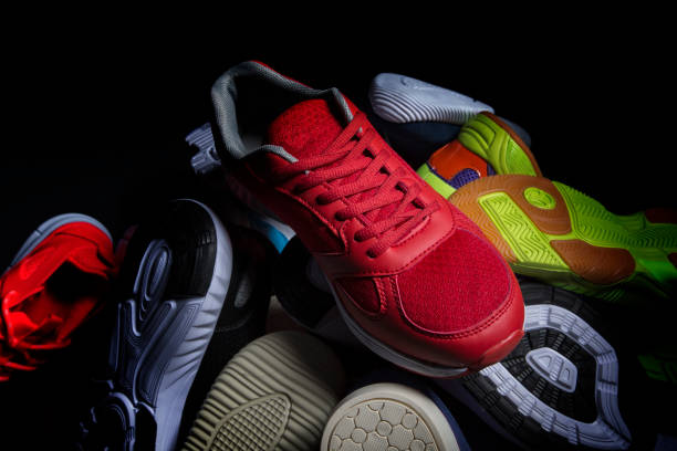 istock Sport shoes. Various sneakers on a dark background. 1440752365